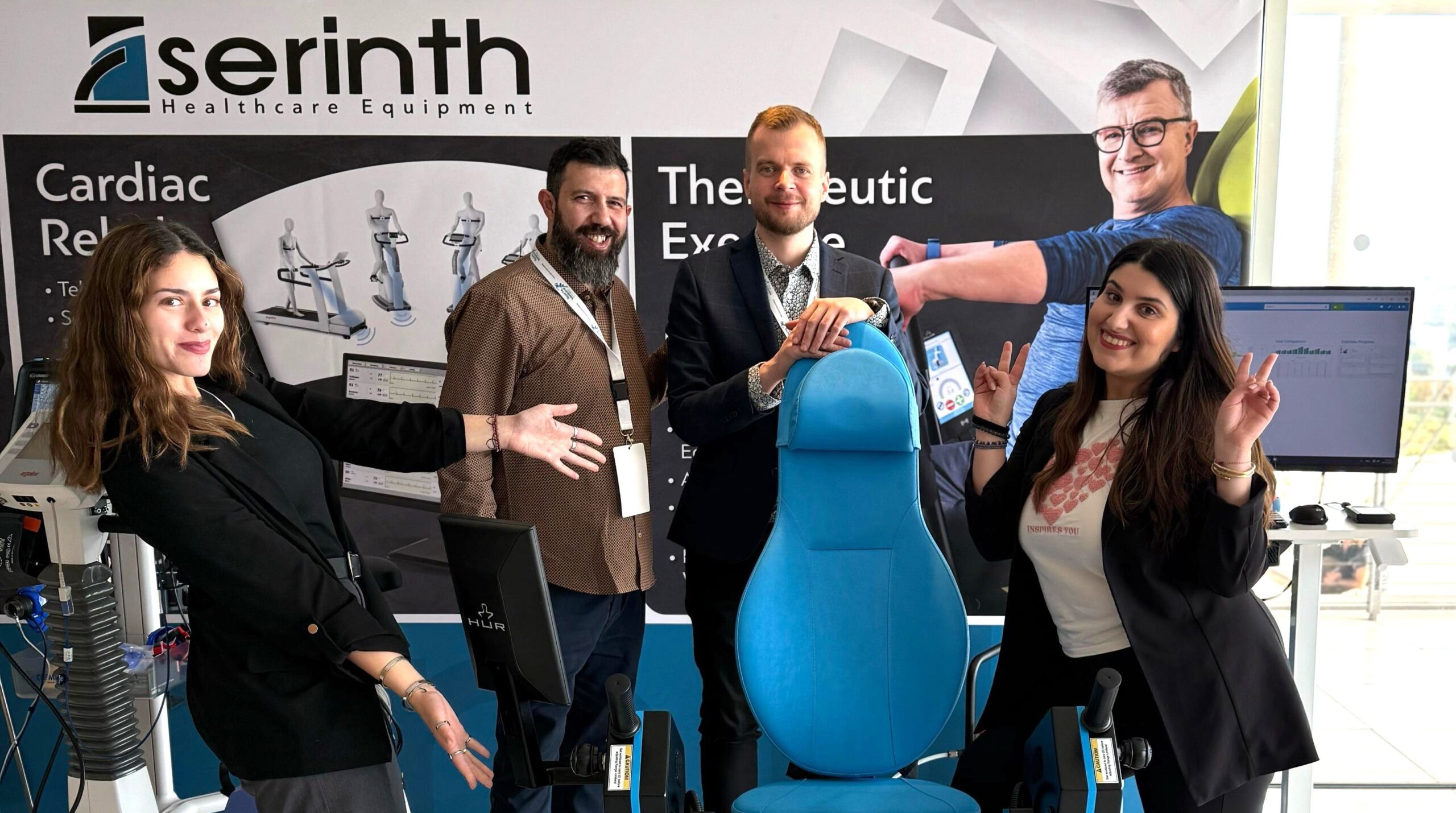 a group of people smiling for a photo in  HUR gym machines at the Isokinetic Conference 2025, themed 'Exploring New Frontiers in Football Medicine