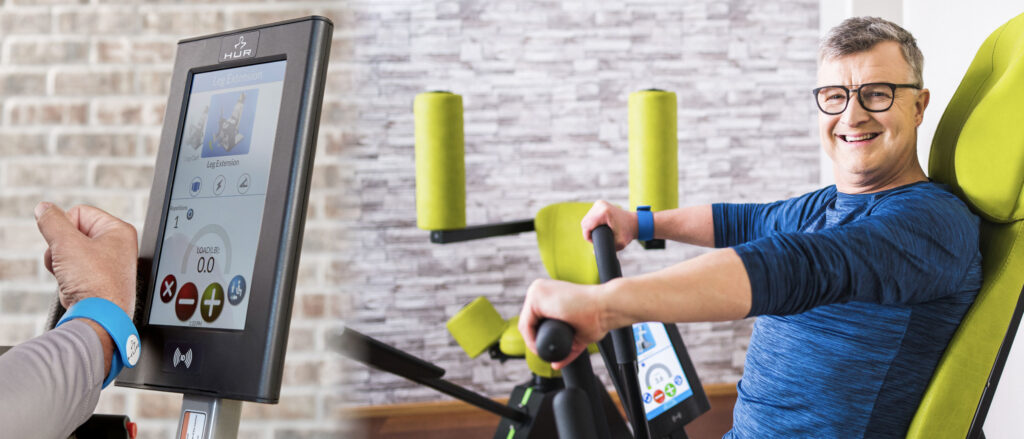 A man training on the HUR gym machine.
