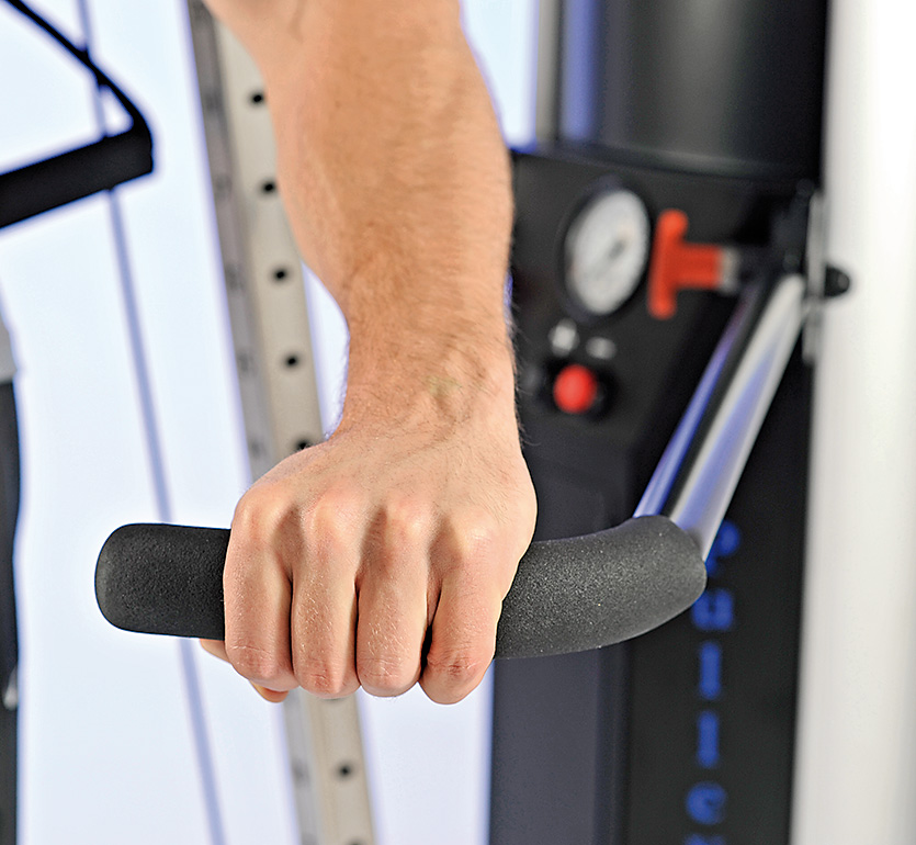 Close-up of adjustable support handles on a HUR pulley machine.