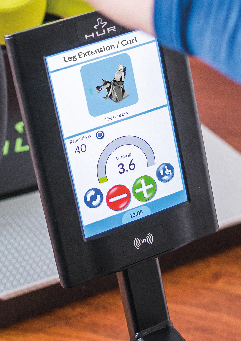 Closeup view of the application interface on a HUR leg extension/curl machine